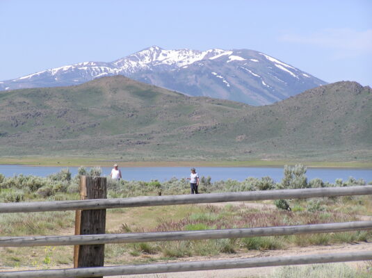 Snow on the peaks above the reservoir