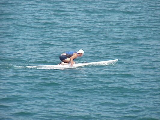 Surfer boy, or is he a lifeguard, spent the afternoon paddling around.