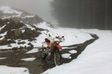 Parked in the snow on the logging road